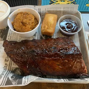 Half slab of smoked baby back ribs, with sweet potato casserole and cor