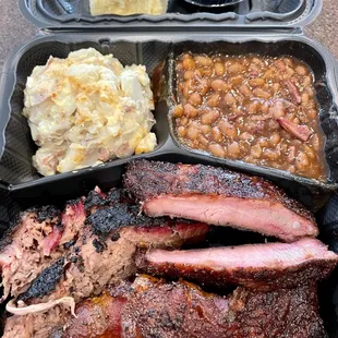 2 Meat Plate (With Brisket) and pork ribs + bacon bomb, Deviled Egg Potato Salad, Burnt End Beans, Dinner Roll
