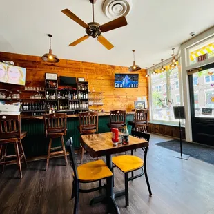 a dining area with a ceiling fan