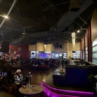 a restaurant with people sitting at tables