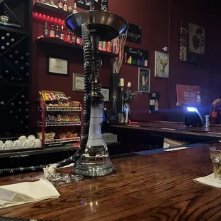 a glass of whiskey on a bar