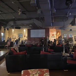 a large room with couches and tables