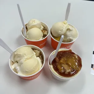 Two CARAMEL APPLE COBBLERS, MANGO PEACH COBBLER, and one strawberry peach cheesecake!
