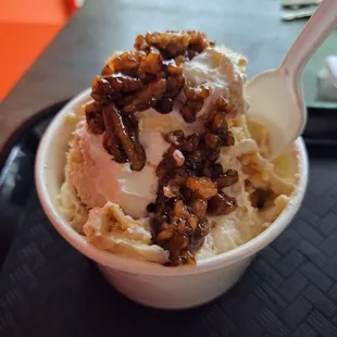 a bowl of ice cream with walnuts