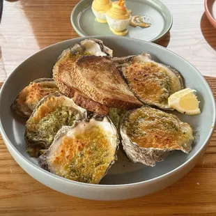 BROILED OYSTERS $18 gulf oyster,  garlic-parsley butter, parmesan, lemon, bread