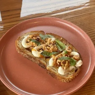 Whipped Ricotta Toast: $11  local bread, whipped ricotta, last year&apos;s peaches, hazelnuts, basil