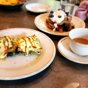 Spanikopita &amp; Two Poached Eggs, Blueberry &amp; Semolina Pancakes, Vanilla Labneh, Orange Blossom Syrup.