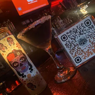 a glass of wine with a qr code on it