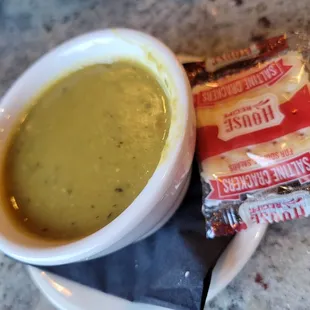 a bowl of soup and chips