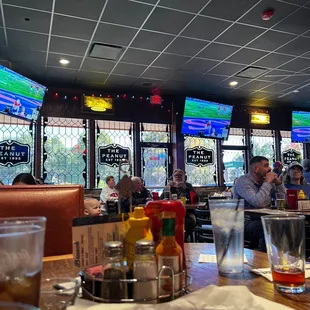 people sitting at tables in a restaurant