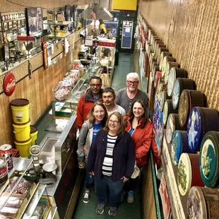 a group of people standing in a store
