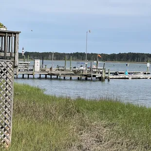 a dock with a boat docked in the water