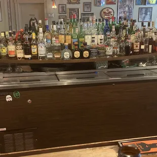 a bar filled with bottles of alcohol