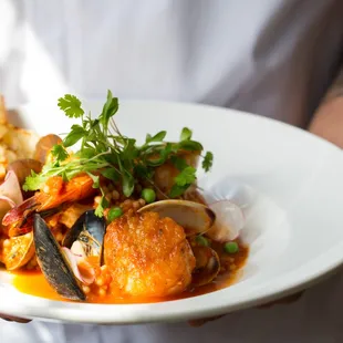 a person holding a plate of food