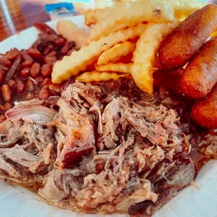 Pulled pork, baked beans, fries and hush puppies.