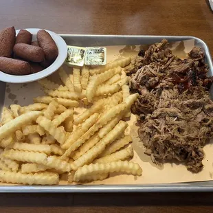 Pulled Pork, Seasoned Fries and Hush Puppies