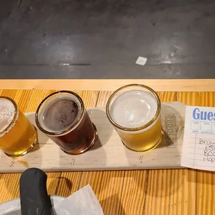 a flight of beers on a table