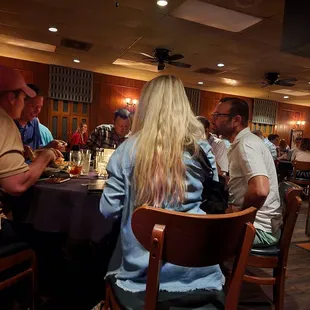 a group of people sitting at a table