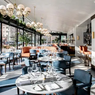 a dining room with tables and chairs