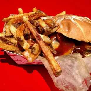 The Grizzly, slathered in BBQ sauce, with a heaping helping of fries.