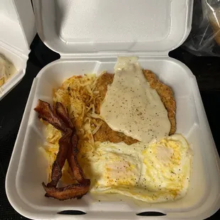 Chicken Fried Steak &amp; Eggs, with a side of bacon to go order! Delicious