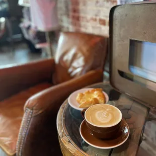 a cup of coffee and a croissant