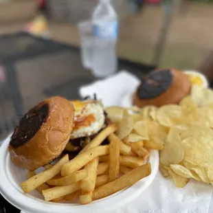 Two Farmhouse Burgers with fries and chips