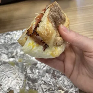 Bacon egg and pepper jack cheese on English muffin