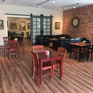 a dining room with tables and chairs