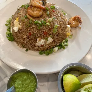 a plate of fried rice with shrimp