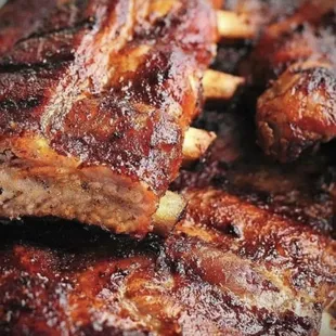 a pile of ribs on a plate