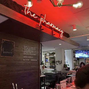 a neon sign above the counter
