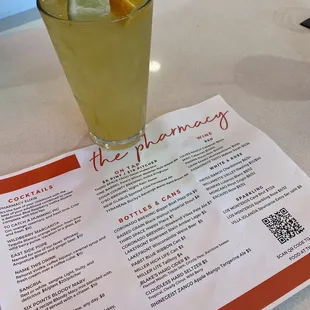 a glass of lemonade with a slice of lime