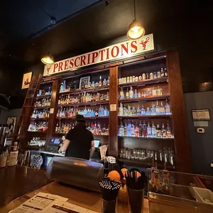 a man behind a bar counter
