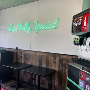 a soda machine and tables