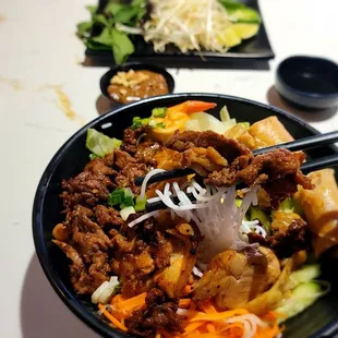 Combination vermicelli bowl $17 comes with pork, chicken and egg roll