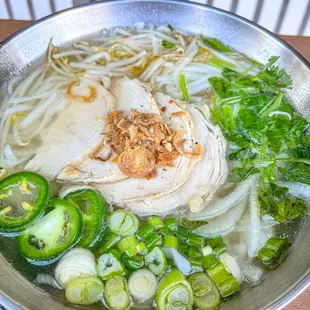 Chicken pho bowl with sliced chicken and chicken broth