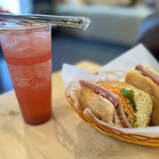 a sandwich and a drink on a table