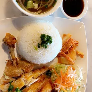 Deep fried chicken with rice and side of soup