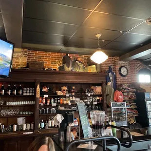 a bar with a television above the bar