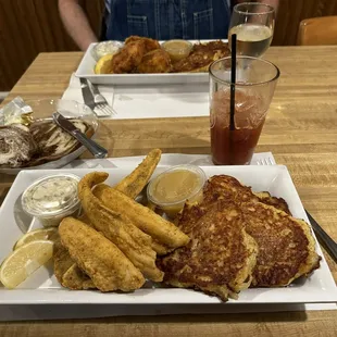 a plate of food and a glass of beer