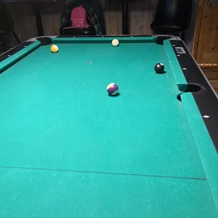 a pool table with balls on it