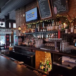 a bar with lots of bottles of alcohol