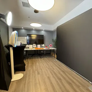 Event set-up for a Real Estate Networking event. In this picture we have the photobooth, professional lighting, props and backdrop.