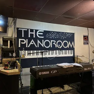 a keyboard, speakers, and other musical equipment