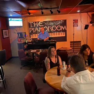 a group of people sitting around a table