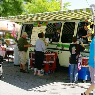 a group of people at a food truck