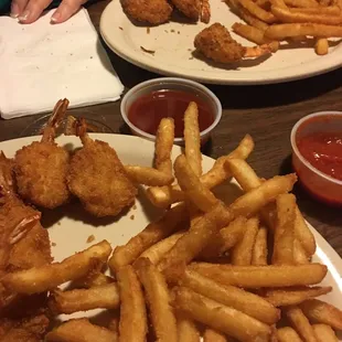 a plate of fried chicken and french fries