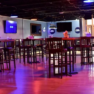 a large room with tables and chairs