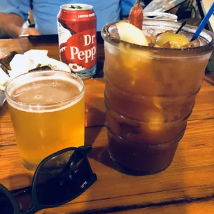 a drink and a can of dr pepper